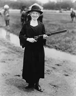 Annie Prints: Annie Oakley (1860-1926), in 1922 with a gun given to her by Buffalo Bill