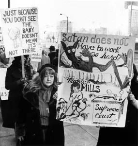 Demonstrate Prints: Anti-abortion demonstrators march outside the Federal courts Building in downtown St