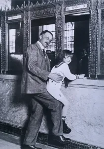 Banks Prints: A.P. Giannini helps child actor Jackie Coogan up to the teller's window at the Bank of Italy renamed Bank of