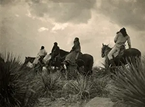 Curtis Prints: Apaches. Before the storm- Four Apache on horseback on horseback under storm clouds