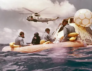 Spacesuits Prints: Apollo 12 Pacific recovery. Astronauts are in a life raft near the Command module with a Helicopter hovering above