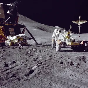 Spacesuits Prints: Apollo 15 astronaut James Irwin loads the Lunar Roving Vehicle with tools