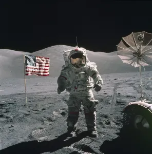 Spacesuits Prints: Apollo 17 Astronaut stands between a US flag and the Lunar Rover during the last US manned mission to the Moon