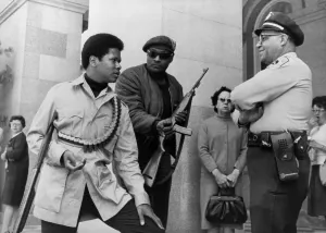 Black Panthers Prints: Two armed Black Panthers, carrying a shotgun