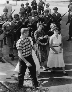 Arkansas Prints: Armed National Guardsmen disperse a group of White students as they staged a walkout from Central High School in Little