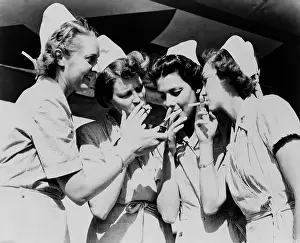 Cigarettes Prints: Army nurses lighting up their cigarettes in 1947
