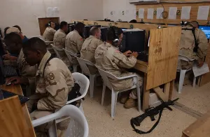 Iraq Prints: US Army soldiers e-mail their families before eating Thanksgiving dinner at Camp Cobra in Iraq on Nov