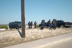 Mass Murder Prints: US Army SWAT team approaching a building where home-grown terrorist Major Nidal Malik Hasan is held up at Fort Hood