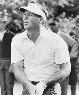 Arnold Prints: Arnold Palmer watching the flight of his ball in a 1965 golf tournament