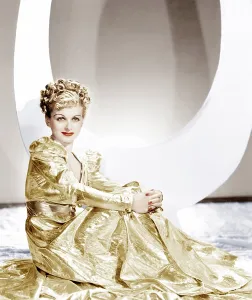 Gold Lame Prints: ARTISTS AND MODELS ABROAD, Joan Bennett wearing a gold lame negligee designed by Edith Head