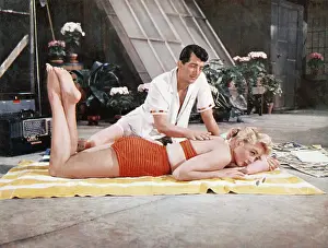 Sunbathing Prints: ARTISTS AND MODELS, front to back: Dorothy Malone, Dean Martin, 1955