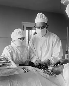 Patient Prints: Assisting surgeon and surgical nurse with specialized instruments during an operation