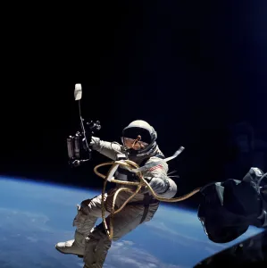 Spacesuits Prints: Astronaut Edward White floating weightless during the first US spacewalk. June 3, 1965