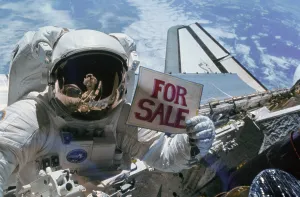 Space Suit Prints: Astronaut Gardner holds a For Sale sign after the orbital retrieval of two malfunctioning satellites the Western Union