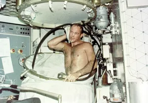 Nasa Prints: Astronaut Jack R. Lousma, taking a hot bath in the crew quarters aboard Skylab