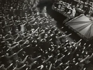 Salute Prints: Attendees give Hitler the Nazi salute during the nation anthem, Oct. 9, 1935