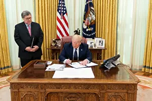 Barr Prints: Attorney General William Barr looks on as President Donald Trump signs an executive order