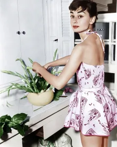Flowers Prints: Audrey Hepburn creates a flower arrangement, ca. early 1950s