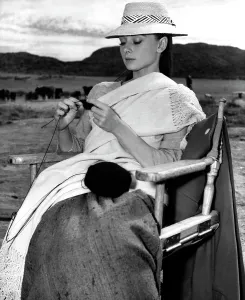 Sitting In Chair Prints: Audrey Hepburn, on location in Durango, Mexico knitting a cashmere sweater ca. 1959