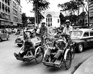 Soldier Prints: Australian Soldiers are taken in Pedicabs through the streets of Saigon to do their Christmas shopping