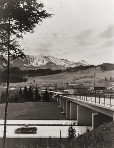 Convertible Prints: Automobile approaching overpass on the German Autobahn with countryside and mountains in the background