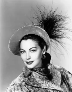 Feathered Hat Prints: Ava Gardner, modeling a gray velvet hat trimmed with goose feathers, 1946