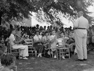 Song Prints: A band leader and his band, original caption: The high school band had been practicing up for weeks