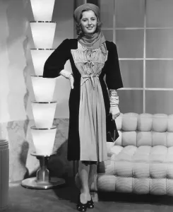 Stanwyck Prints: Barbara Stanwyck in black silk jersey and chartreuse street frock designed by Royer, 1938