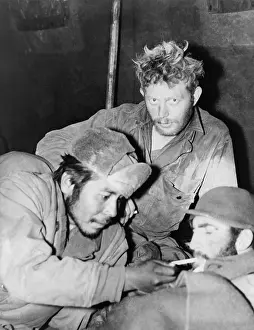 Cigarettes Prints: Bearded GIs relax in a medical clearing station after their release as POWs by Chinese Communists