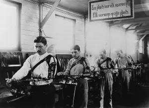 Disabled Prints: Four Belgian WW1 veterans with a prosthetic arms working in a machine shop in 1917
