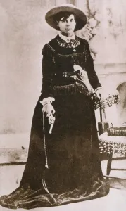 Revolvers Prints: Belle Starr (1848-1889), photographed holding a revolver