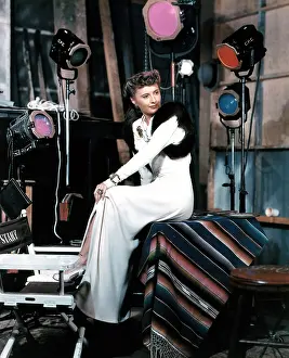 YOU BELONG TO ME, Barbara Stanwyck, on-set, in a gown by Edith Head, 1941