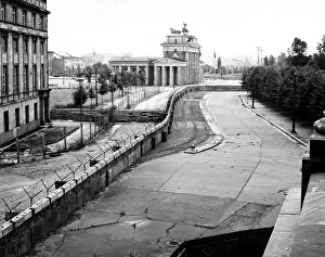 Germany Prints: The Berlin Wall against the background of Brandenburg Gate in the heart of the city