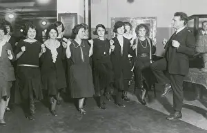 Publisher Prints: Bernarr Macfadden exhorting employees to exercise in his NYC publishing office, 1922