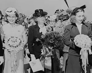 Bess Prints: Bess (center) and Margaret Truman (right) during christening ceremony of two Naval airplanes
