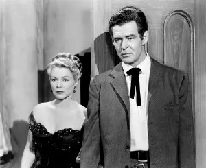 Images Dated 23rd July 2015: BEST OF THE BADMEN, from left, Claire Trevor, Robert Ryan, 1951
