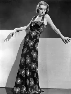 Womens Fashion Prints: Bette Davis wearing crepe yellow and green print gown, ca. 1937