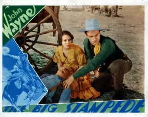 February Prints: THE BIG STAMPEDE, from left, Mae Madison, John Wayne, 1932