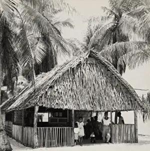 Lcgr1507 Prints: Bikini Islanders in their thatched roof home, ca. March 1946. When the U.S