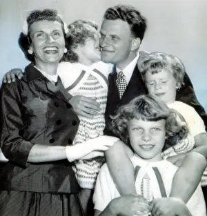 Billy Prints: Billy Graham greeted by wife, Ruth & daughters Virginia
