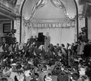 Movie Stars Prints: Bing Crosby sings to Allied troops at the London Stage Door Canteen during World War 2