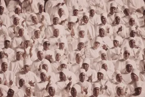 2011 Prints: Black Muslim women dressed in white applaud Elijah Muhammad's Annual Savior's Day message