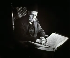 Blind Prints: Blind man reading a Braille book, ca. 1938