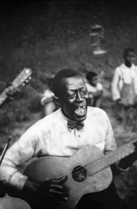 Negro Prints: The Blues. Stavin Chain singing ballad 'Batson