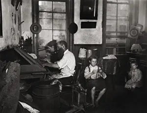 Dwelling Prints: A Bohemian family of four makes cigars working in their tenement home
