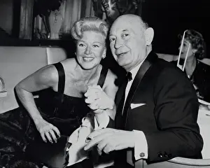 Movie Stars Prints: Boris Morros posing with Ginger Rogers at the Harwyn Club in NYC, Nov. 13, 1957