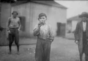 1910s Candid Prints: Boy smoking, original caption: John Tidwell