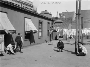 Roof Prints: Boys playing games on the roof of a skyscraper, titled: Living on a skyscraper circa 1920s