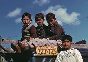 Well Dressed Prints: Boys sitting on truck parked at the FSA labor camp