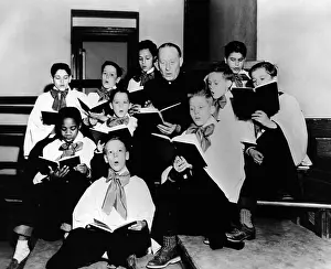 Nebraska Prints: Boys Town Choir rehearsing for their Easter Week appearance on CBS radio